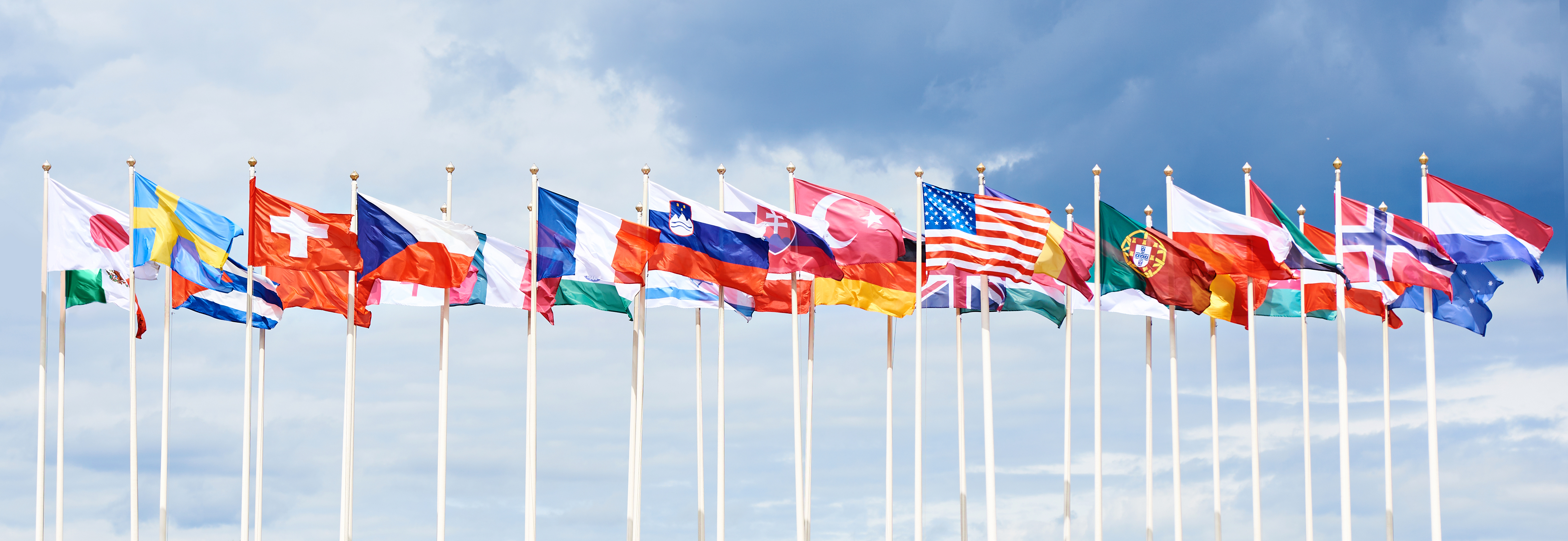 Flags of various countries on high flagpoles