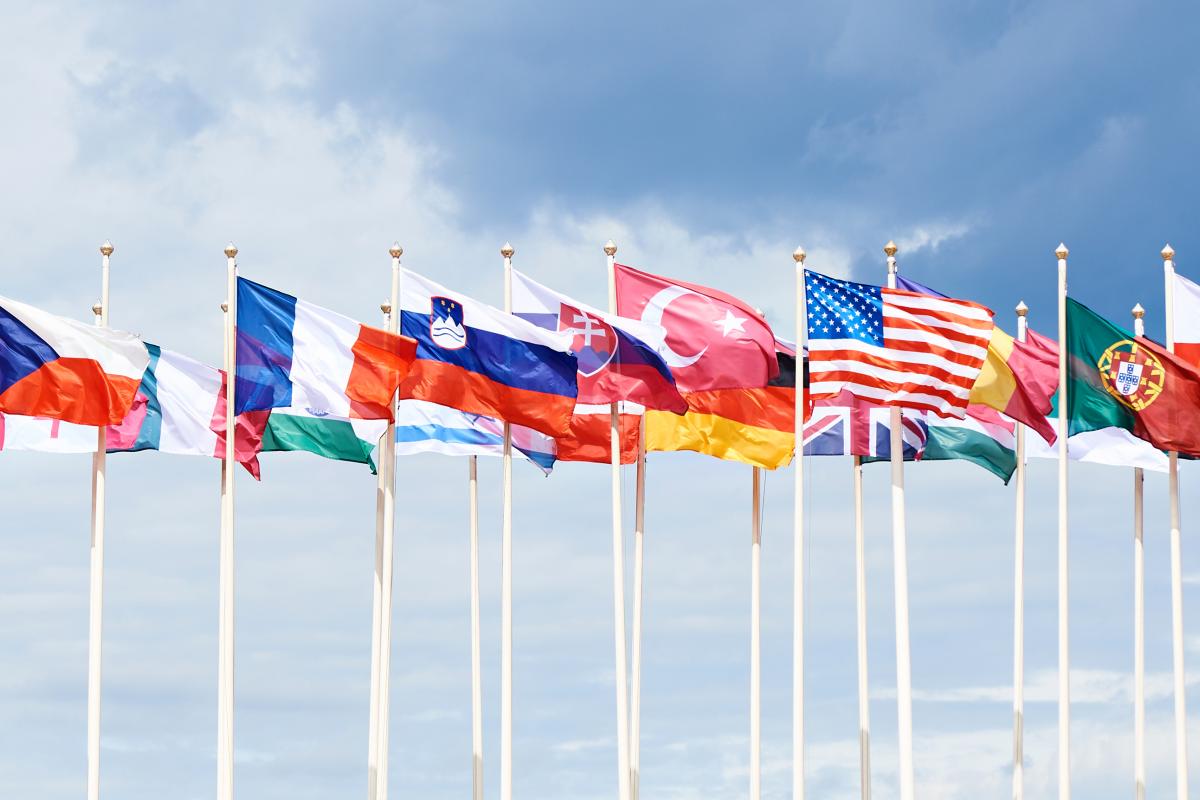 Various country flags on high flagpoles